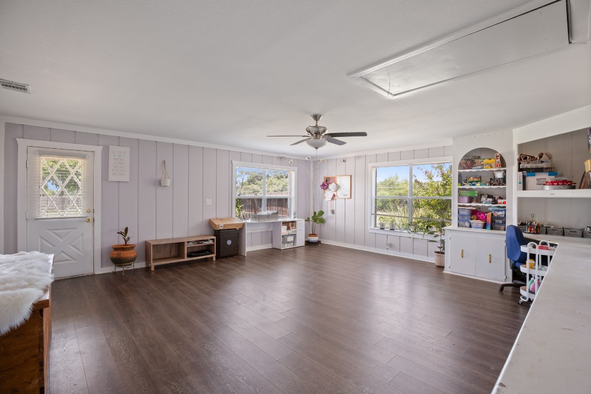 101 Homestead Road Kyle, TX 78640 - Photo 8 of 29 a view of a workspace with furniture and a window