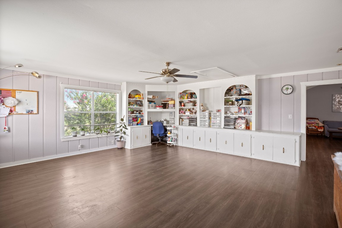 101 Homestead Road Kyle, TX 78640 - Photo 9 of 29 a view of a livingroom with wooden floor and a large window