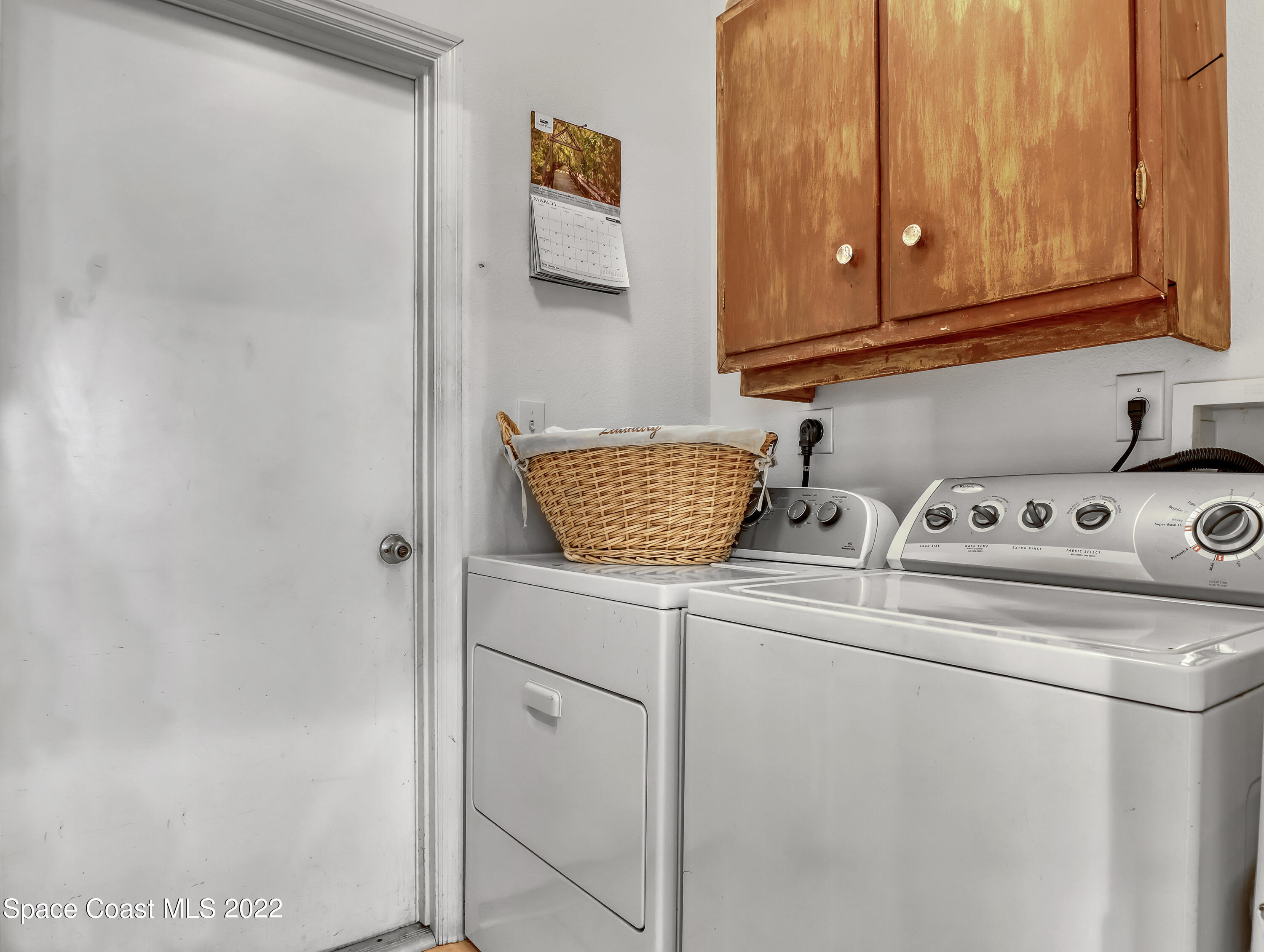 755 Raleigh Road Southeast Palm Bay, FL 32909 - Photo 18 of 36 a sink and a refrigerator in a kitchen