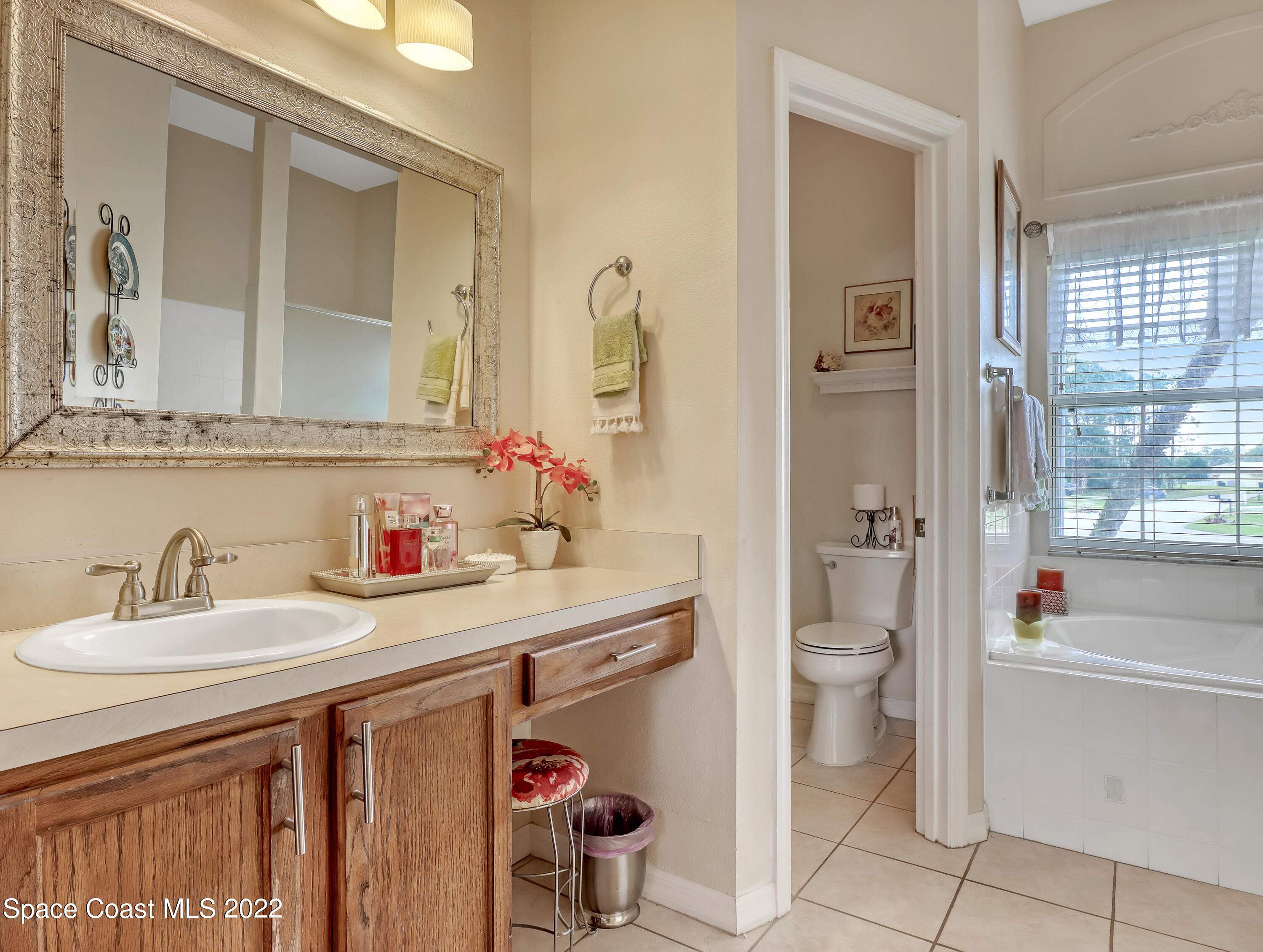 755 Raleigh Road Southeast Palm Bay, FL 32909 - Photo 23 of 36 a bathroom with a sink a toilet and shower