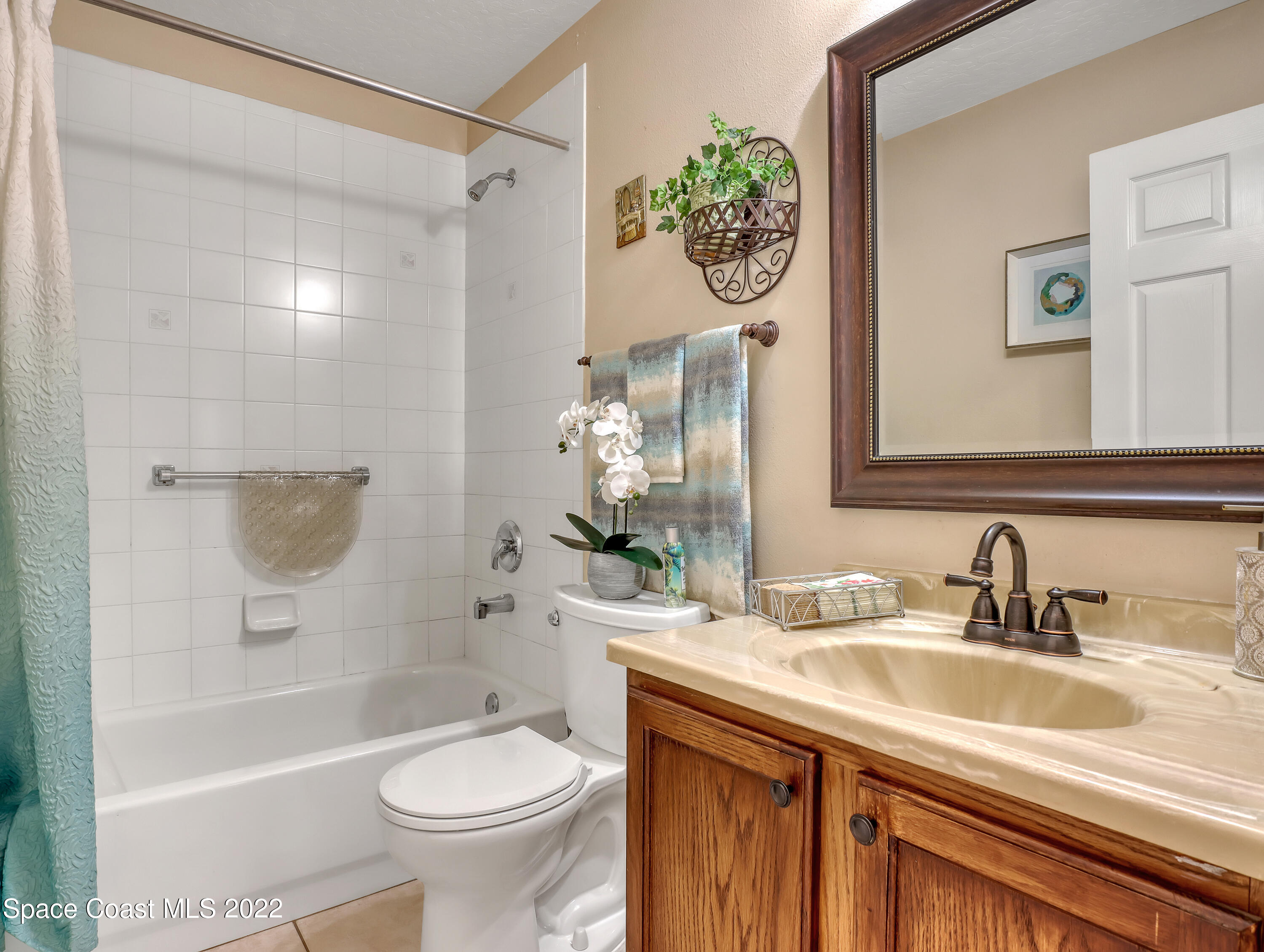 755 Raleigh Road Southeast Palm Bay, FL 32909 - Photo 27 of 36 a bathroom with a sink toilet and shower