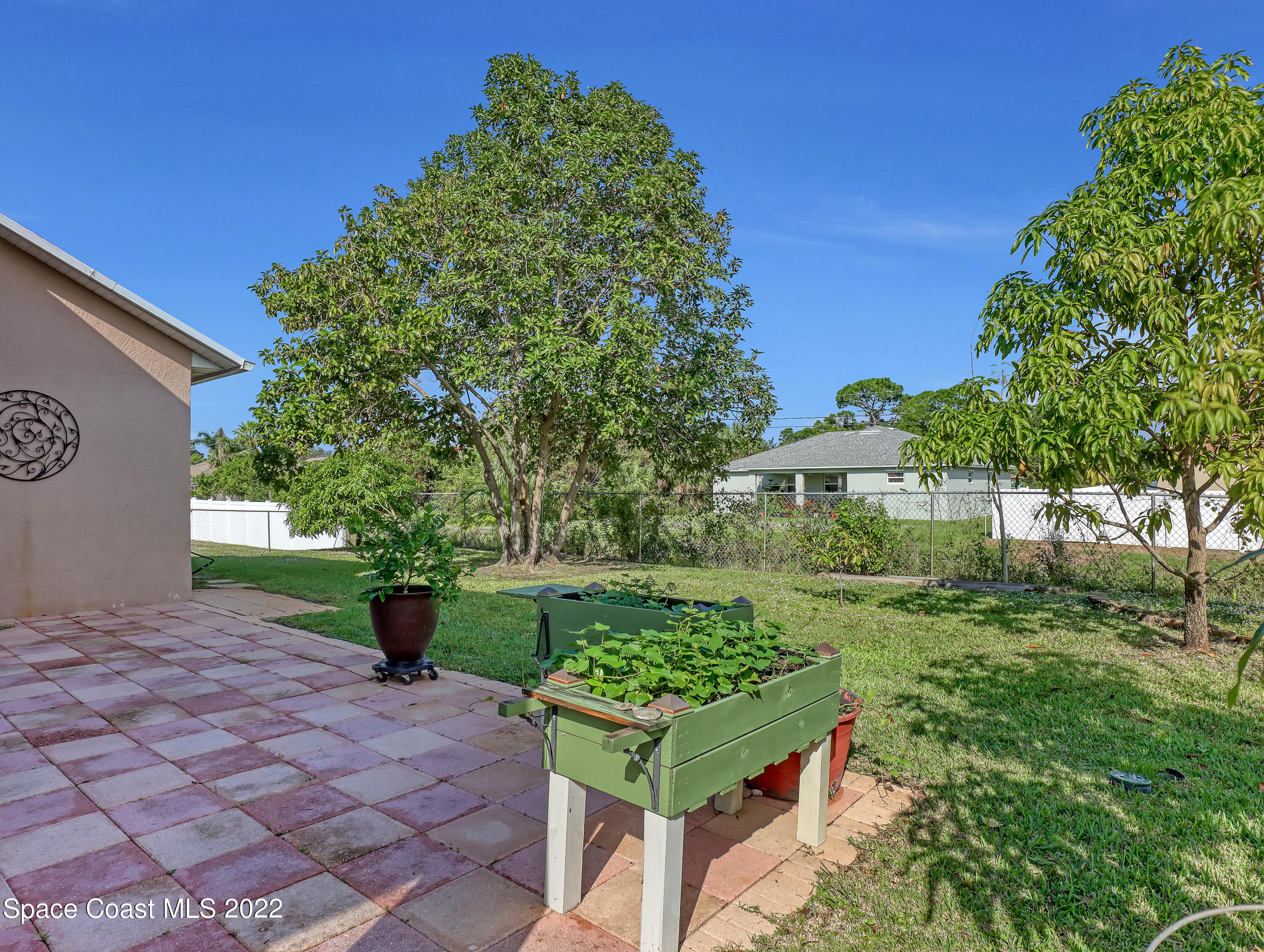 755 Raleigh Road Southeast Palm Bay, FL 32909 - Photo 32 of 36 a garden view with a seating space