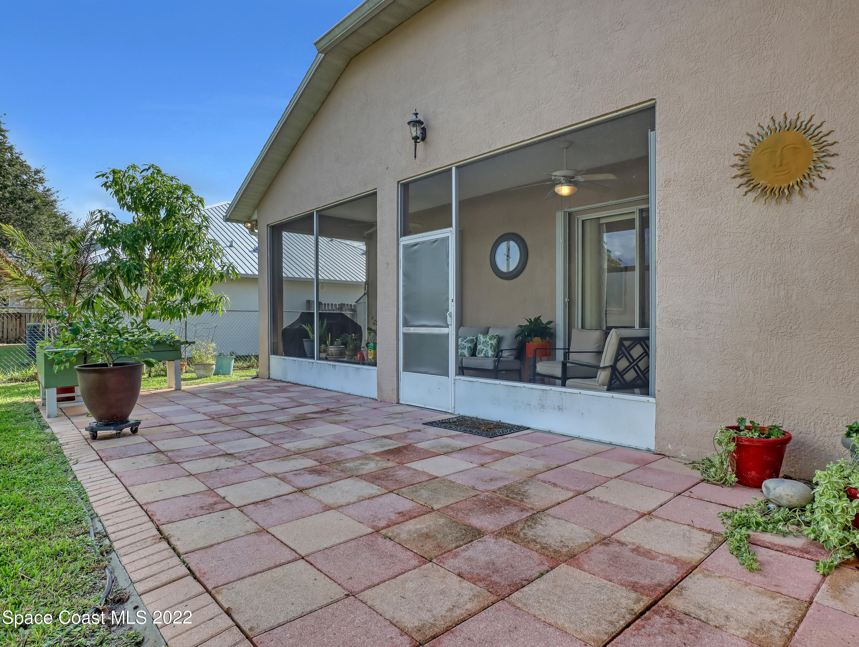 755 Raleigh Road Southeast Palm Bay, FL 32909 - Photo 34 of 36 a front view of a house with a yard