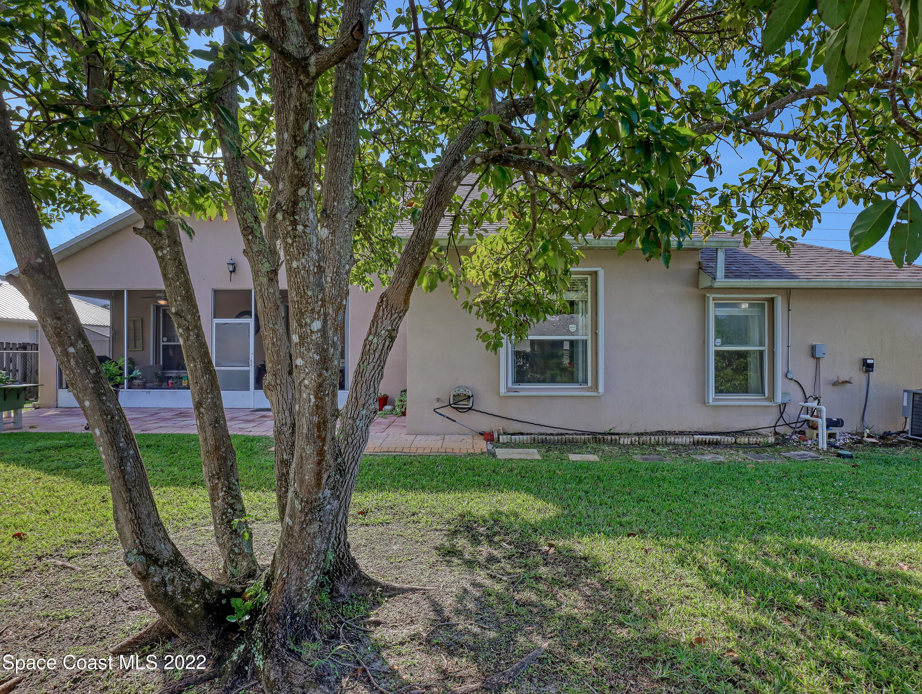 755 Raleigh Road Southeast Palm Bay, FL 32909 - Photo 36 of 36 a front view of a house with garden