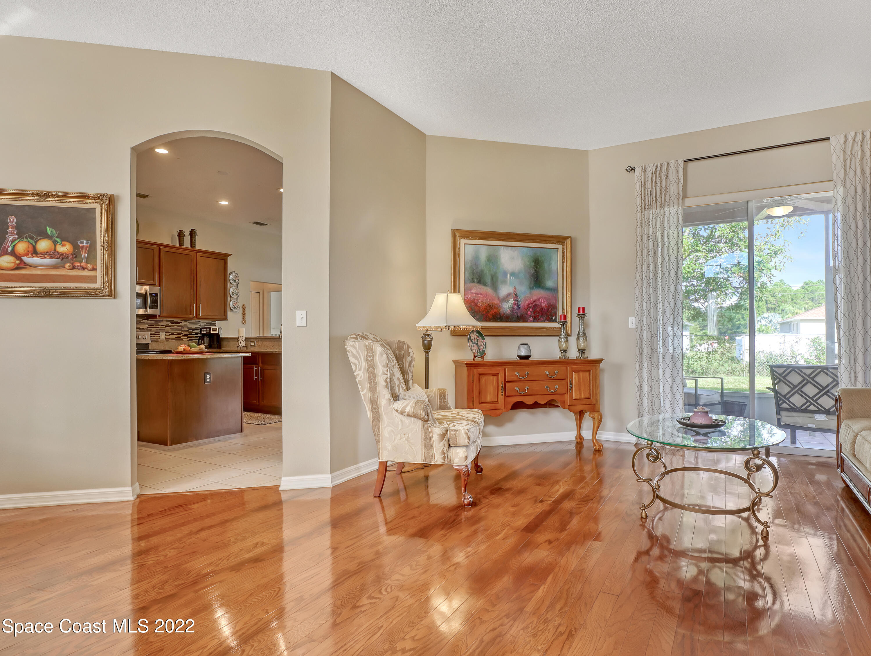 755 Raleigh Road Southeast Palm Bay, FL 32909 - Photo 5 of 36 a living room with furniture and a large window