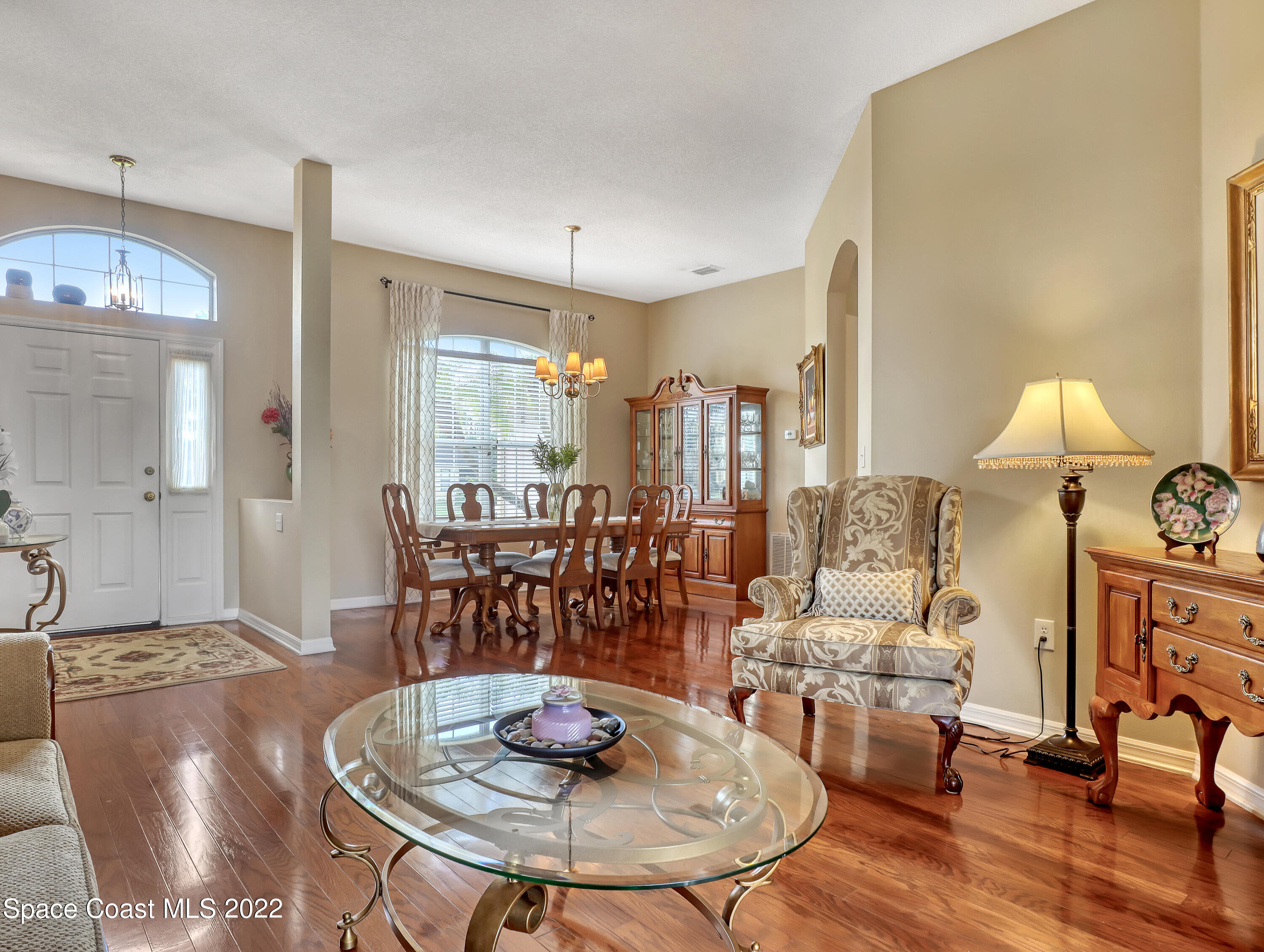 755 Raleigh Road Southeast Palm Bay, FL 32909 - Photo 8 of 36 a living room with furniture and a table