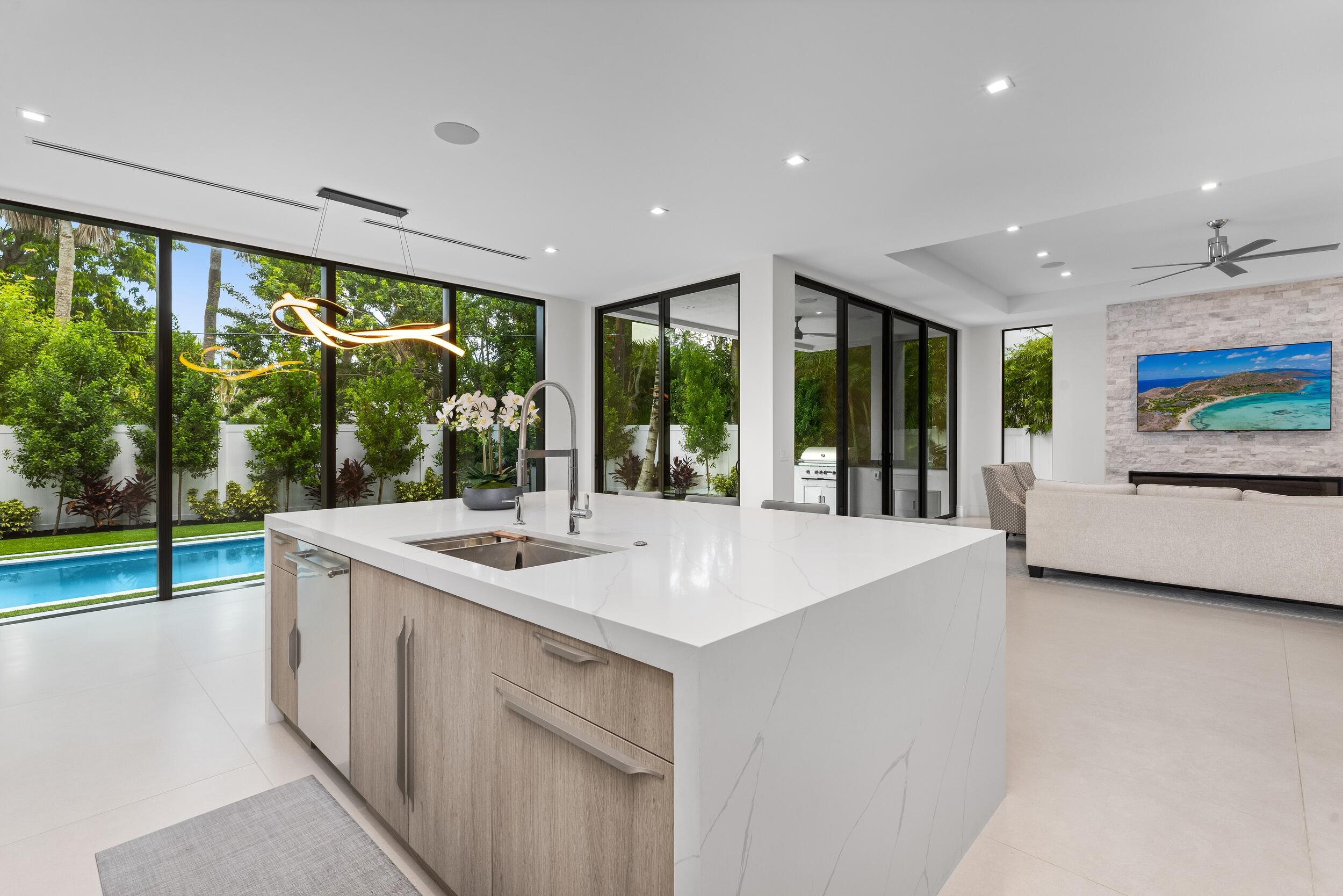 753 Park Drive West Boca Raton, FL 33432 - Photo 11 of 50 a kitchen with large windows and a sink