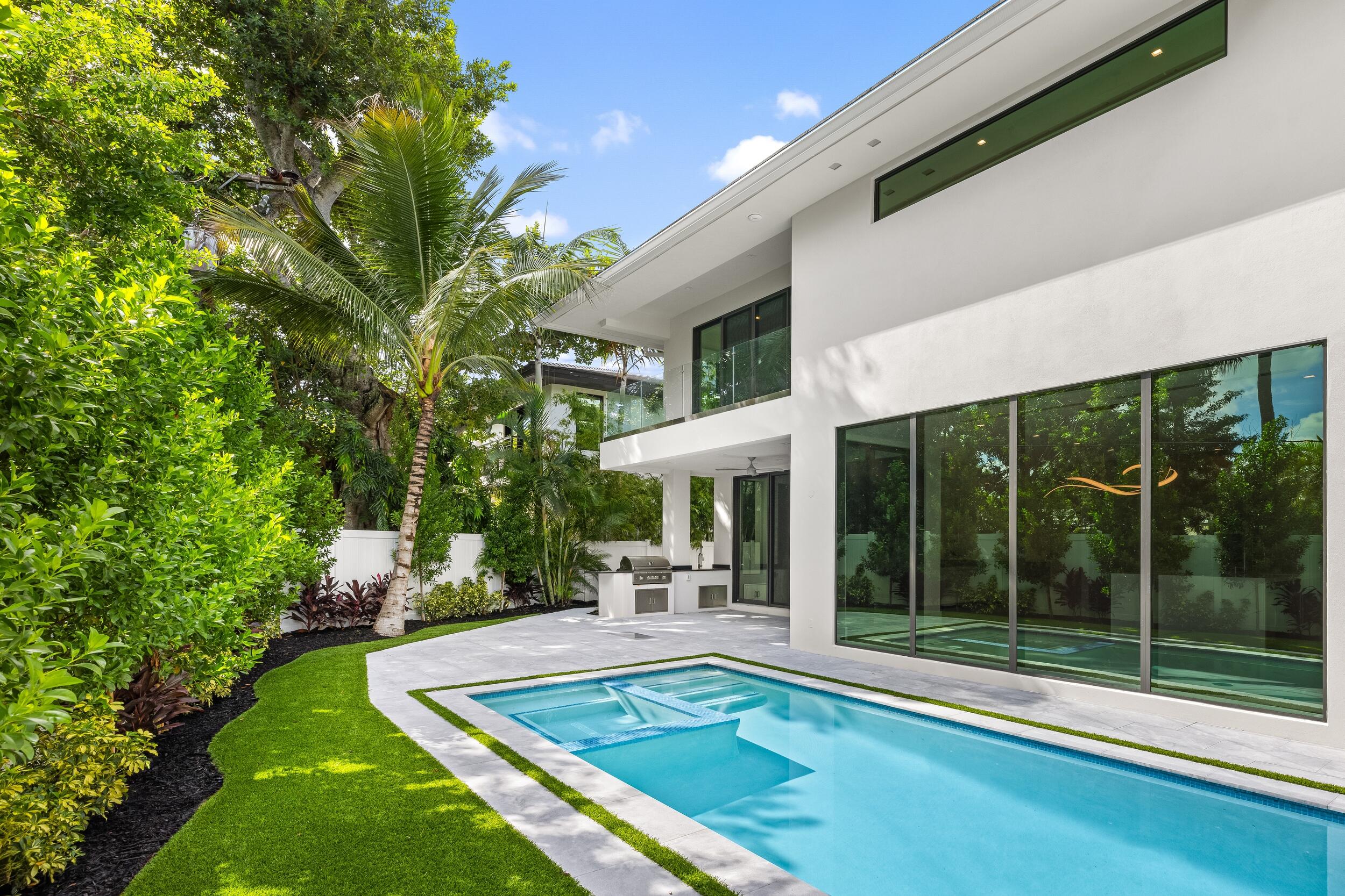 753 Park Drive West Boca Raton, FL 33432 - Photo 18 of 50 a view of a patio with table and chairs potted plants and large tree