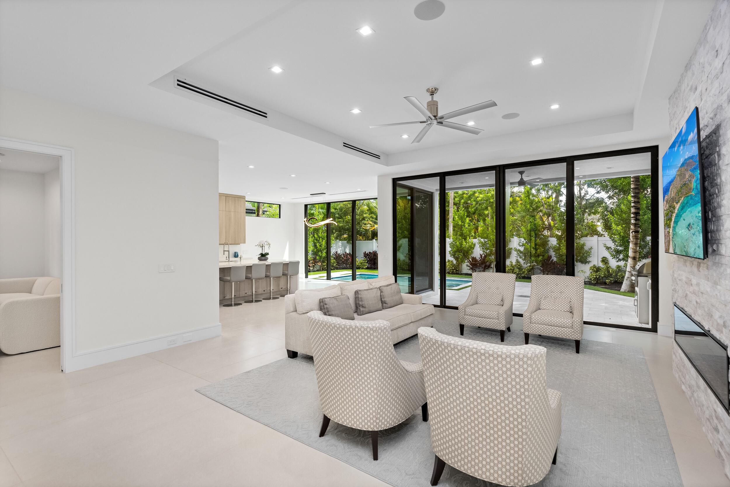 753 Park Drive West Boca Raton, FL 33432 - Photo 26 of 50 a living room with furniture and large windows
