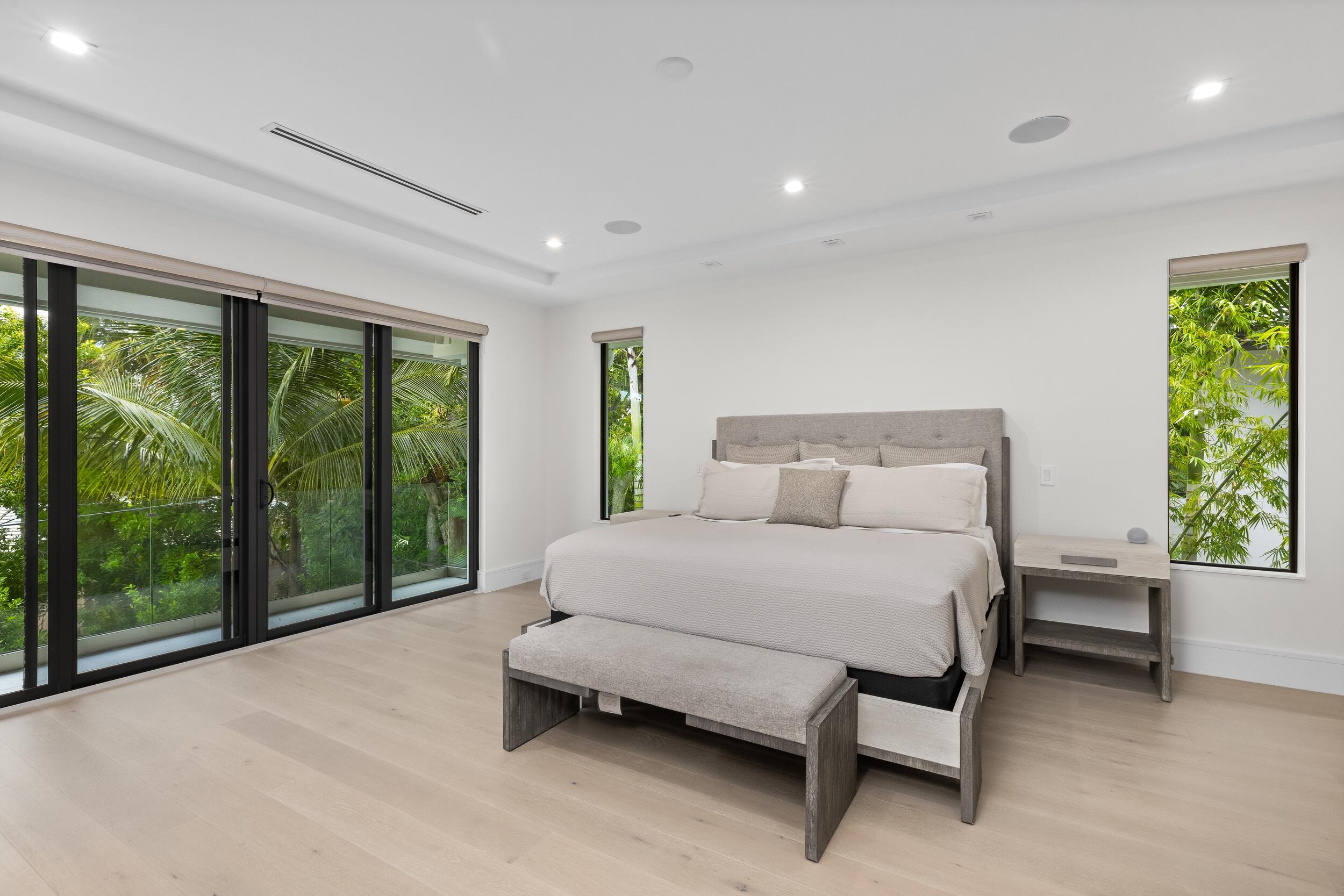 753 Park Drive West Boca Raton, FL 33432 - Photo 34 of 50 a spacious bedroom with a bed and large window