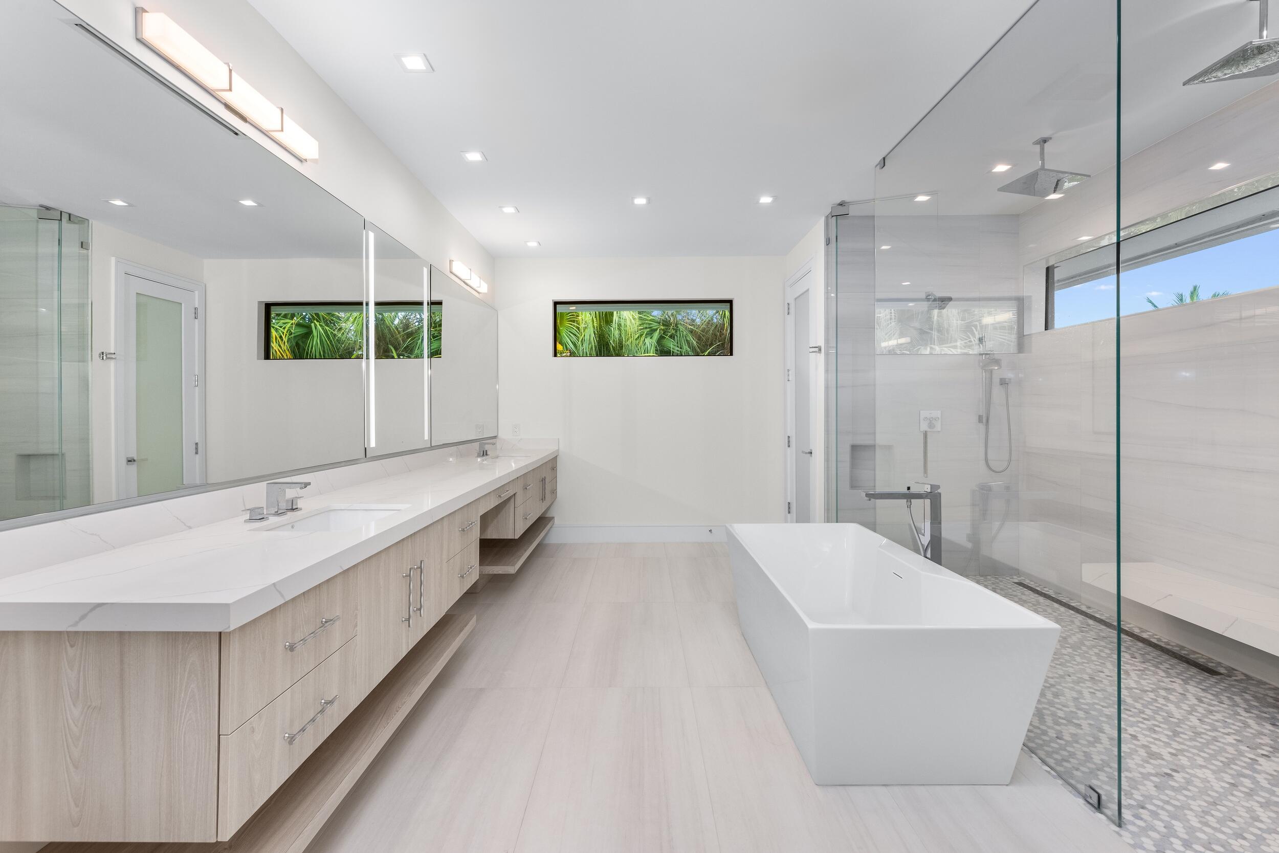 753 Park Drive West Boca Raton, FL 33432 - Photo 36 of 50 a bathroom with a double vanity sink mirror and bathtub