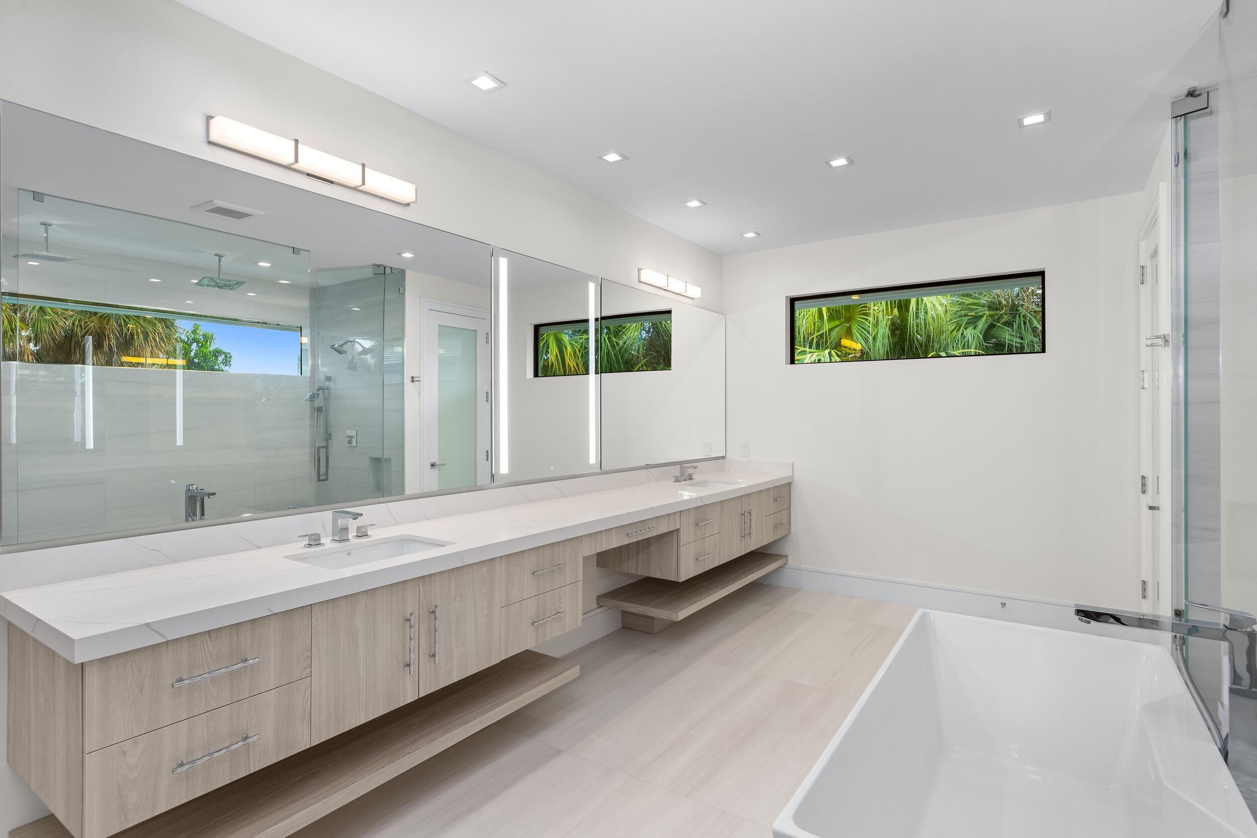 753 Park Drive West Boca Raton, FL 33432 - Photo 37 of 50 a bathroom with a double vanity sink and a mirror