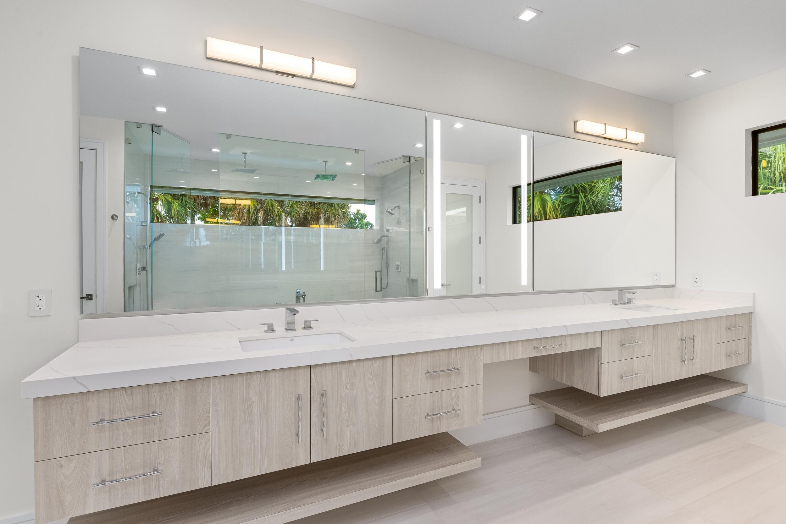 753 Park Drive West Boca Raton, FL 33432 - Photo 38 of 50 a bathroom with a double vanity sink and a mirror