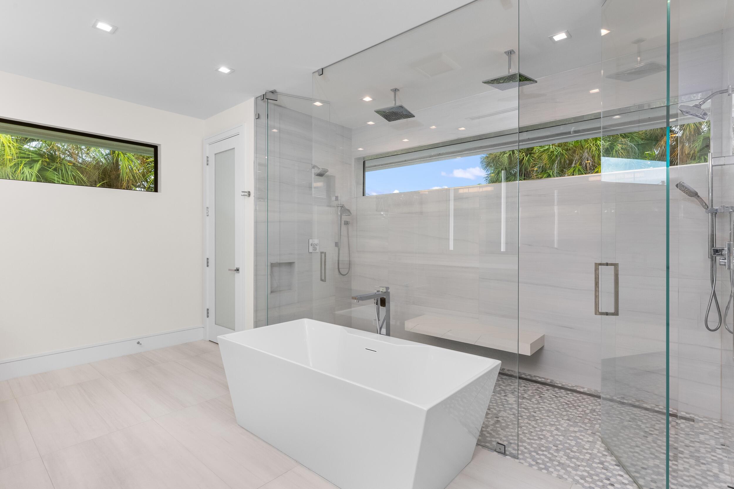 753 Park Drive West Boca Raton, FL 33432 - Photo 39 of 50 a bathroom with a bathtub a shower and a sink