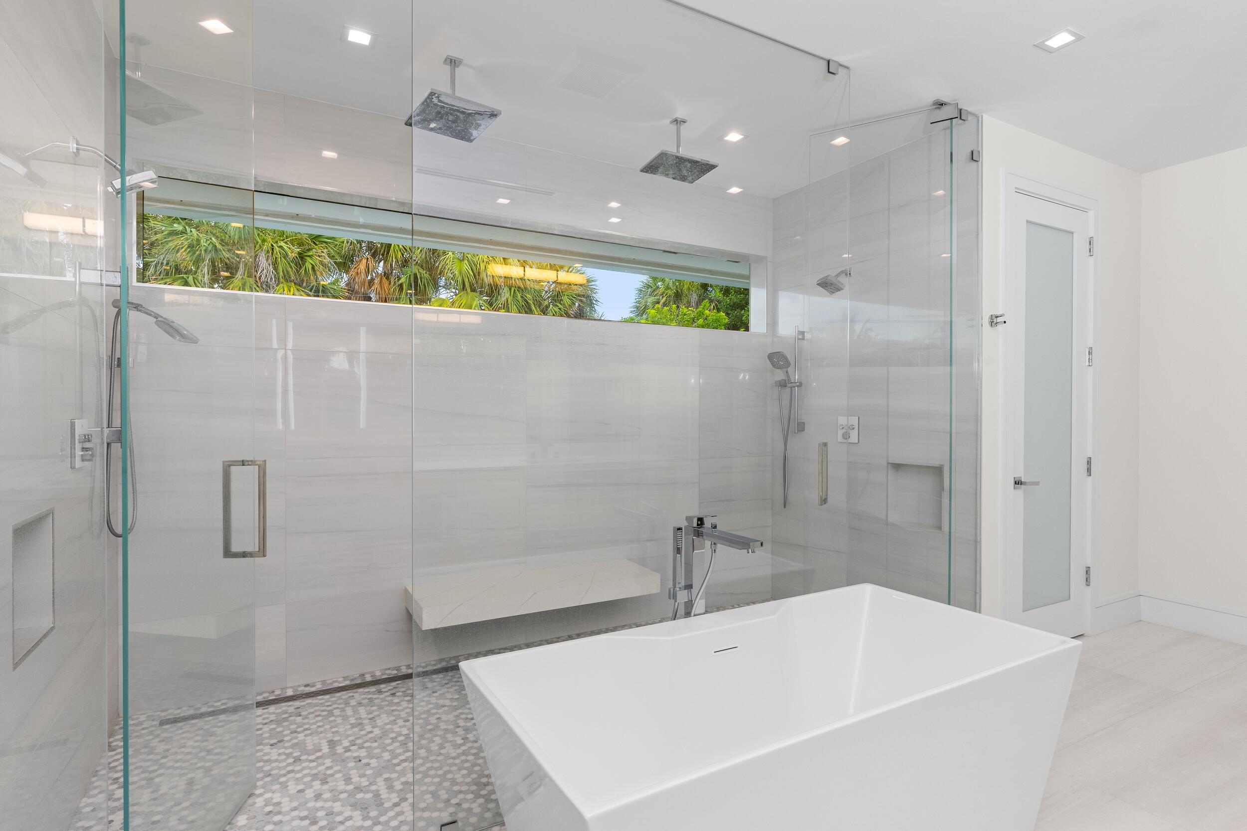 753 Park Drive West Boca Raton, FL 33432 - Photo 40 of 50 a bathroom with a tub a sink and a shower