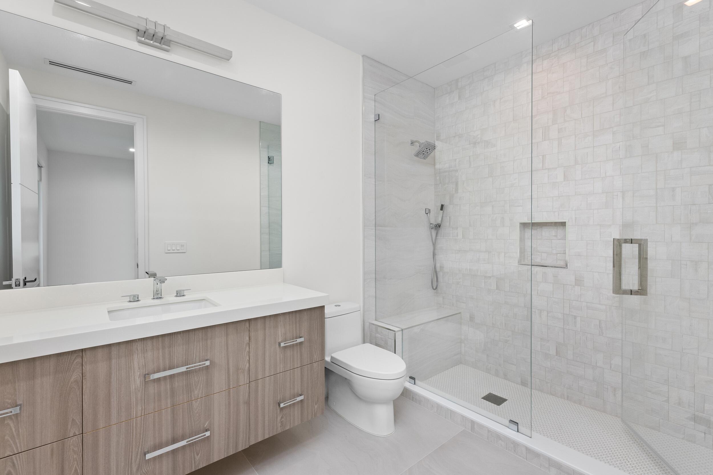 753 Park Drive West Boca Raton, FL 33432 - Photo 44 of 50 a bathroom with a double vanity sink toilet and shower