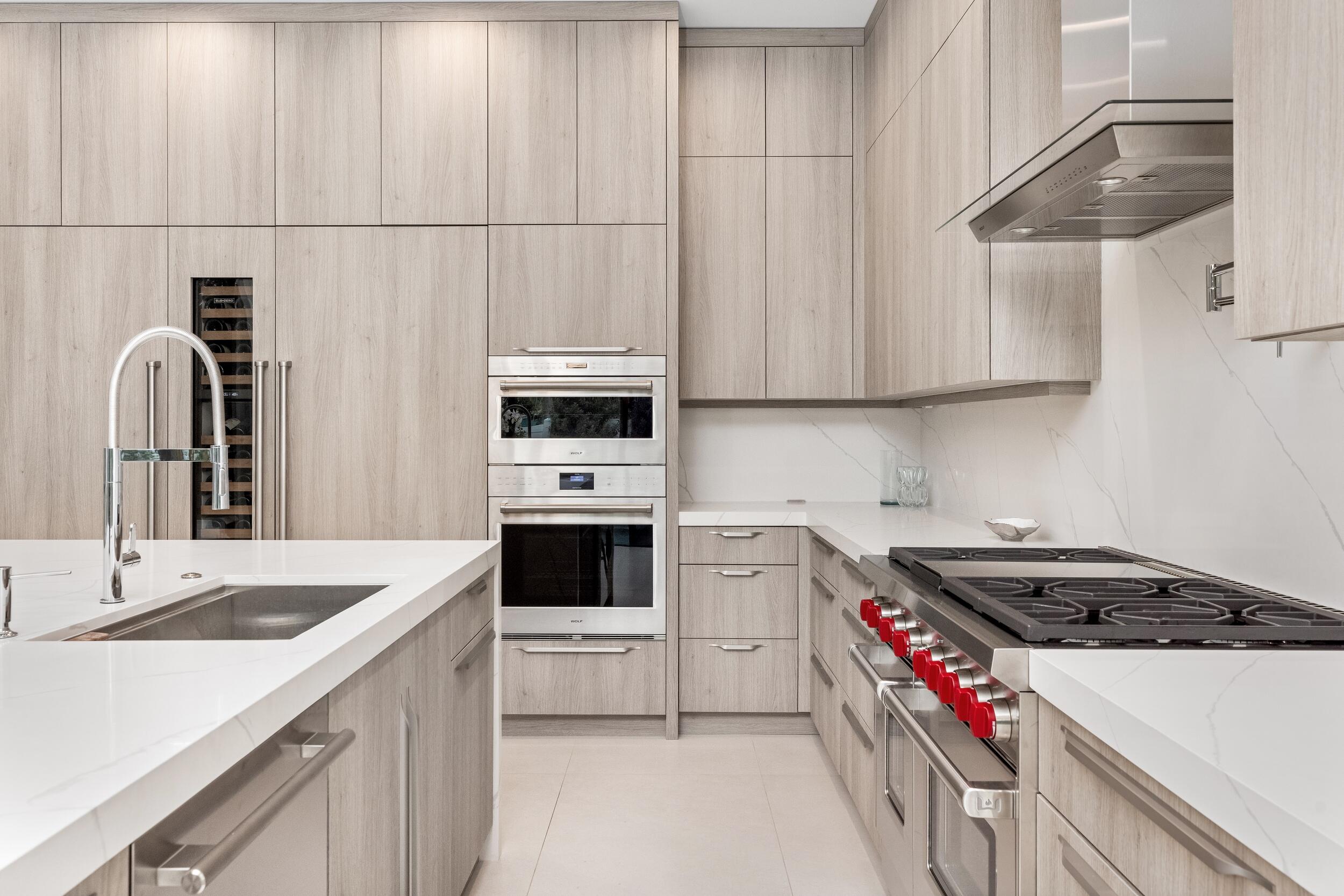 753 Park Drive West Boca Raton, FL 33432 - Photo 8 of 50 a kitchen with granite countertop a sink a stove and cabinets