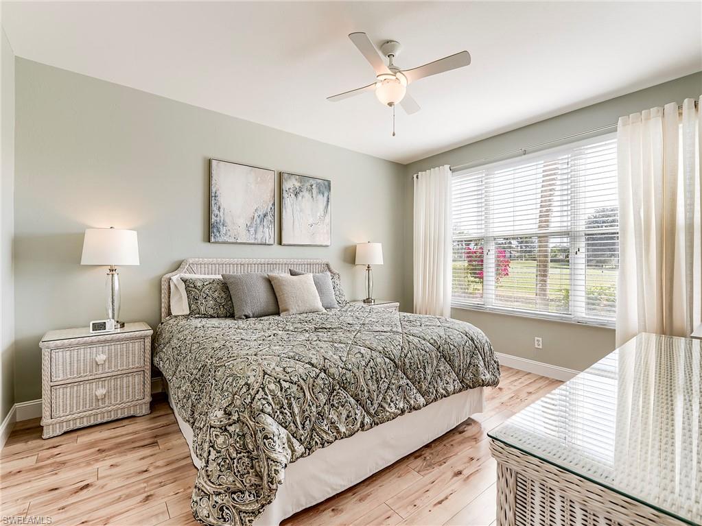 9040 Spring Run Boulevard, Unit 404 Estero, FL 34135 - Photo 14 of 34 a bedroom with a large bed and a window