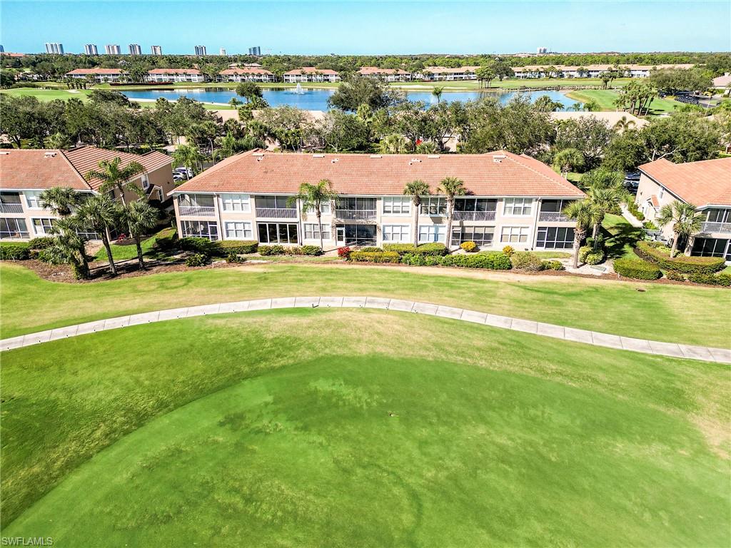 9040 Spring Run Boulevard, Unit 404 Estero, FL 34135 - Photo 25 of 34 an aerial view of residential houses