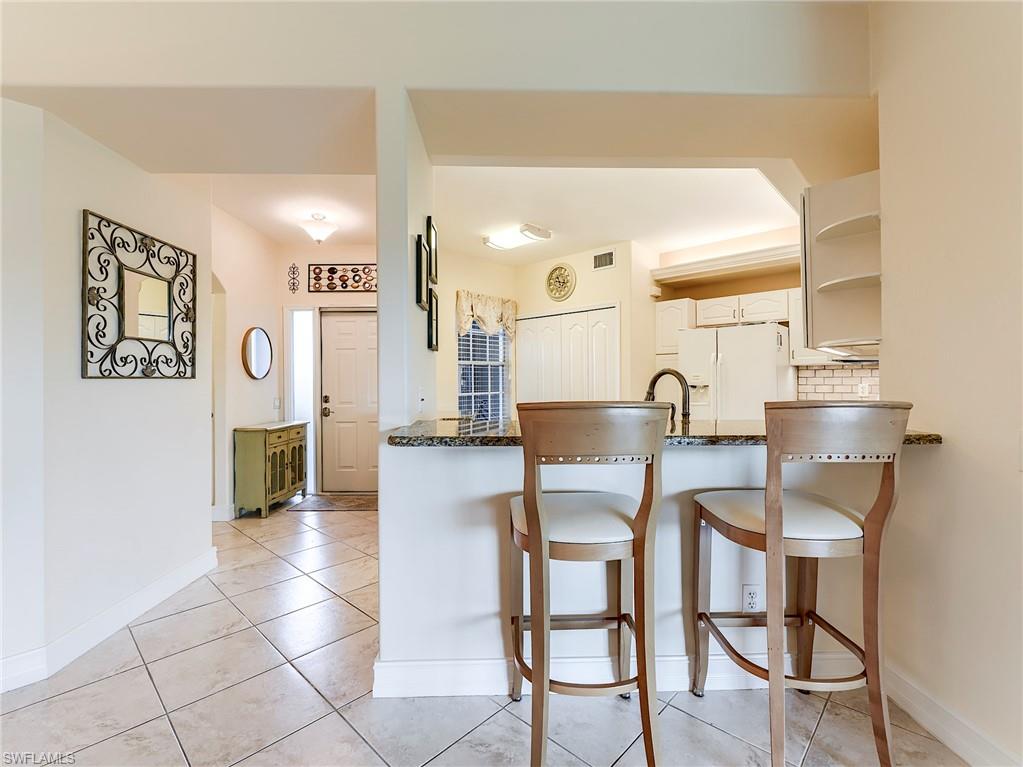 9040 Spring Run Boulevard, Unit 404 Estero, FL 34135 - Photo 10 of 34 a view of kitchen with breakfast area