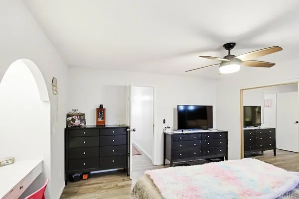 a spacious bathroom with a double vanity sink and a mirror