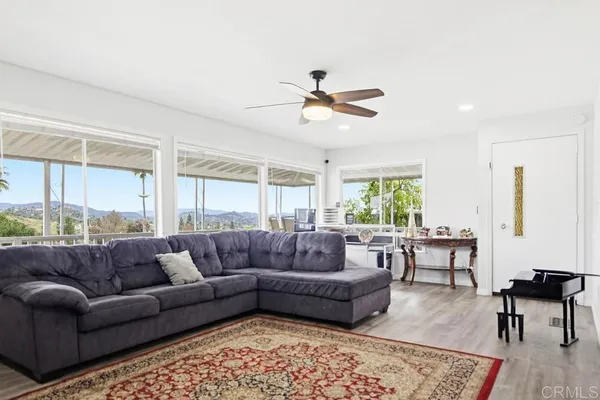 a living room with furniture and a rug