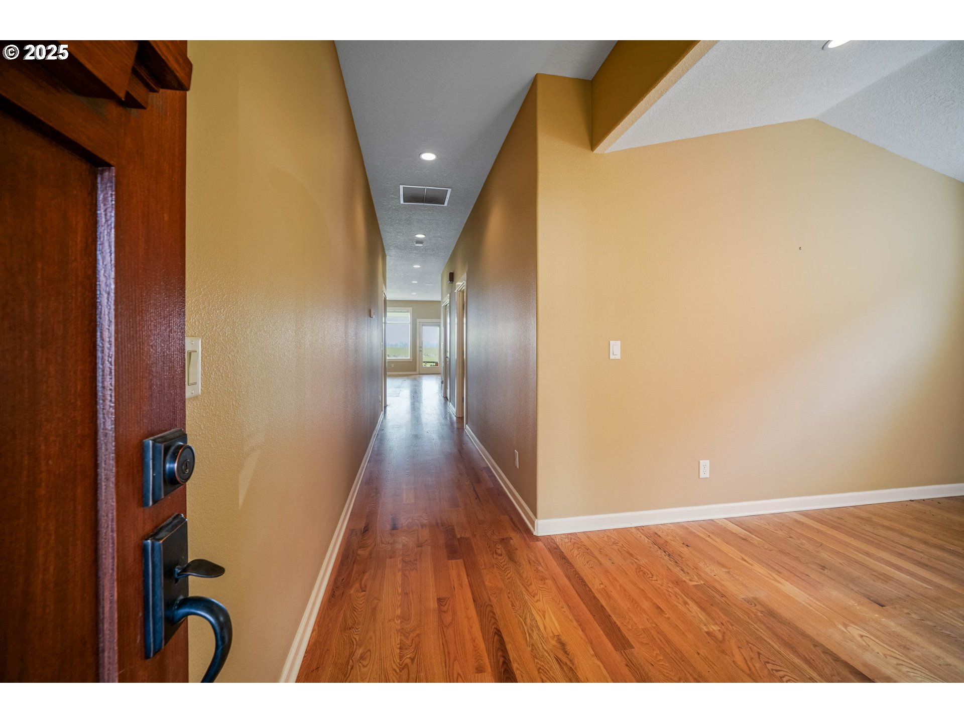 736 Southeast St Andrews Lane Dallas, OR 97338 - Photo 12 of 35 a view of empty room with wooden floor
