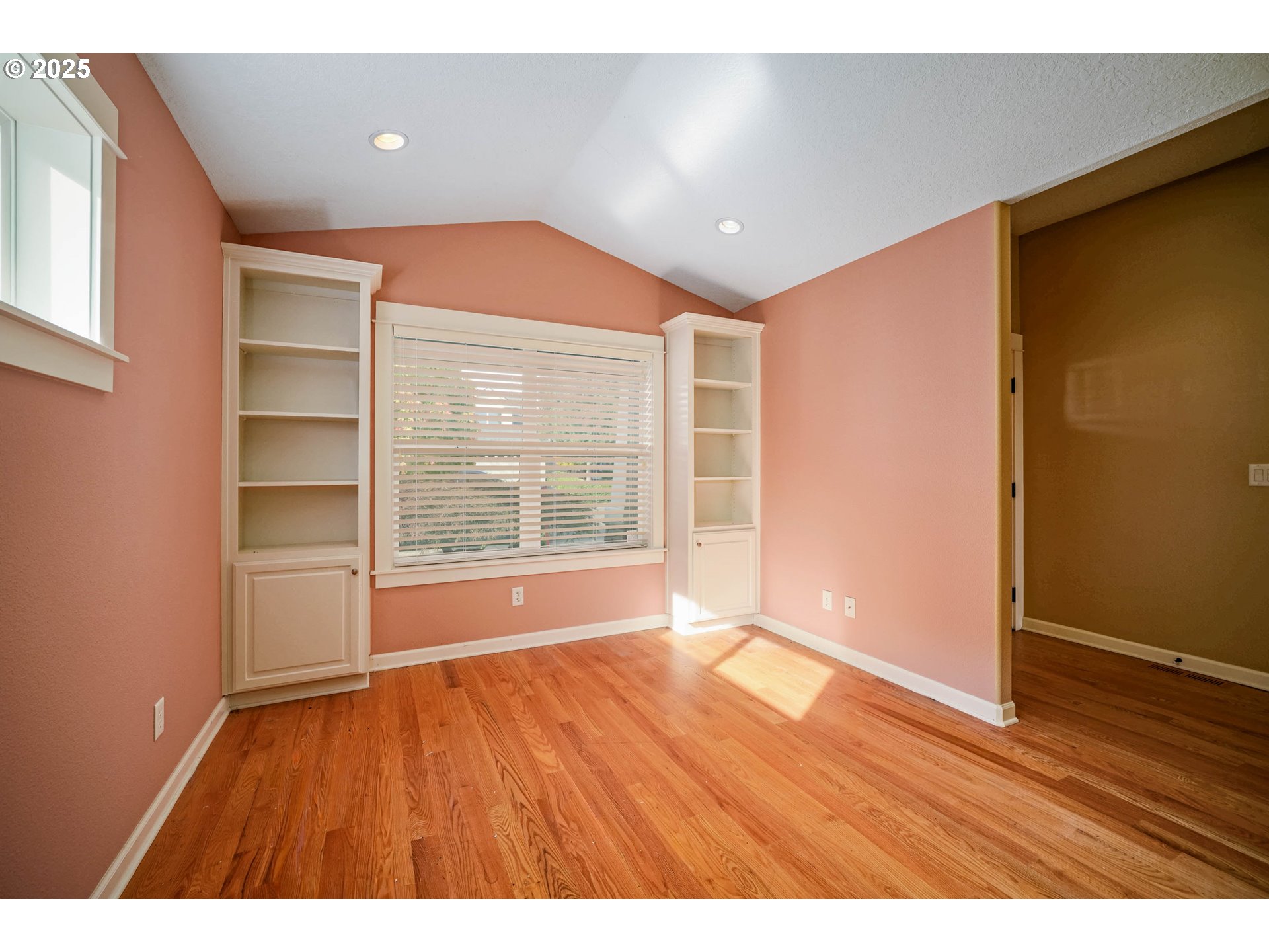 736 Southeast St Andrews Lane Dallas, OR 97338 - Photo 15 of 35 a view of an empty room with wooden floor and a window