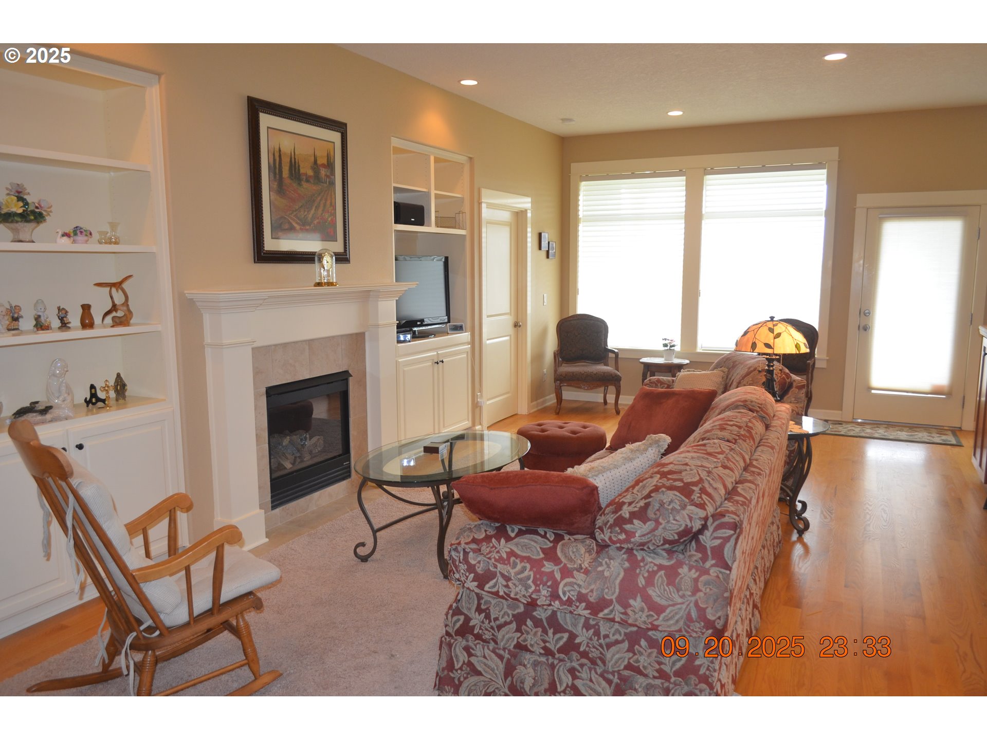 736 Southeast St Andrews Lane Dallas, OR 97338 - Photo 3 of 35 a living room with furniture a fireplace and a large window
