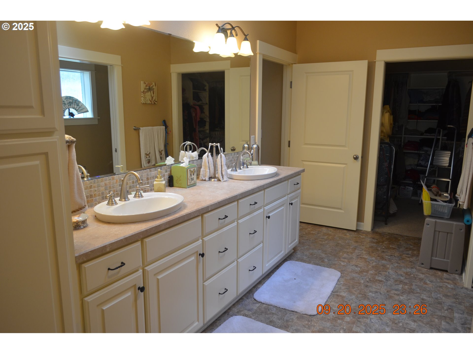 736 Southeast St Andrews Lane Dallas, OR 97338 - Photo 7 of 35 a bathroom with a double vanity sink and a mirror