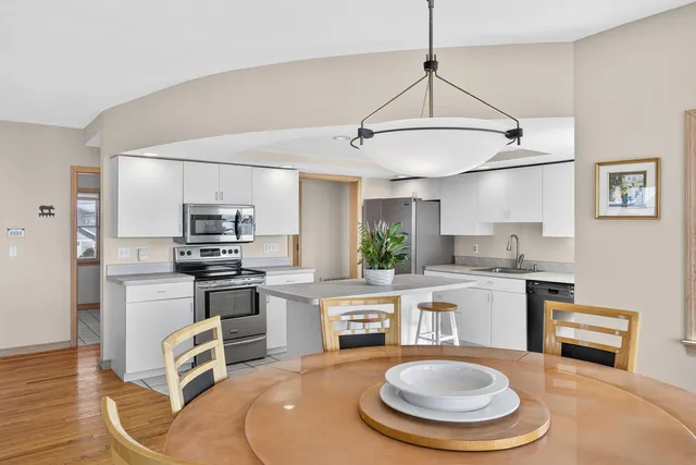 a view of a living room and dining room