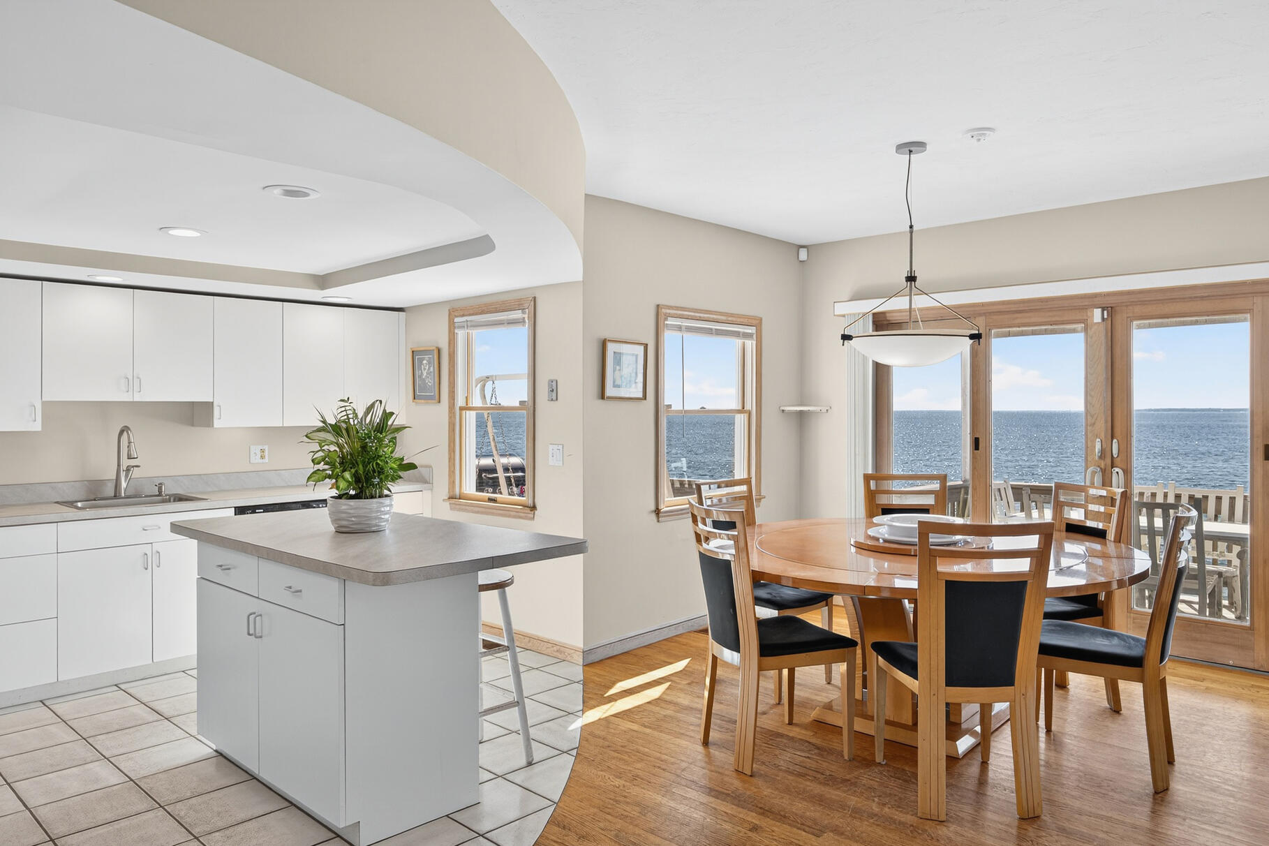 61 Menauhant Road East Falmouth, MA 02536 - Photo 19 of 65 a view of a dining room with furniture window and wooden floor