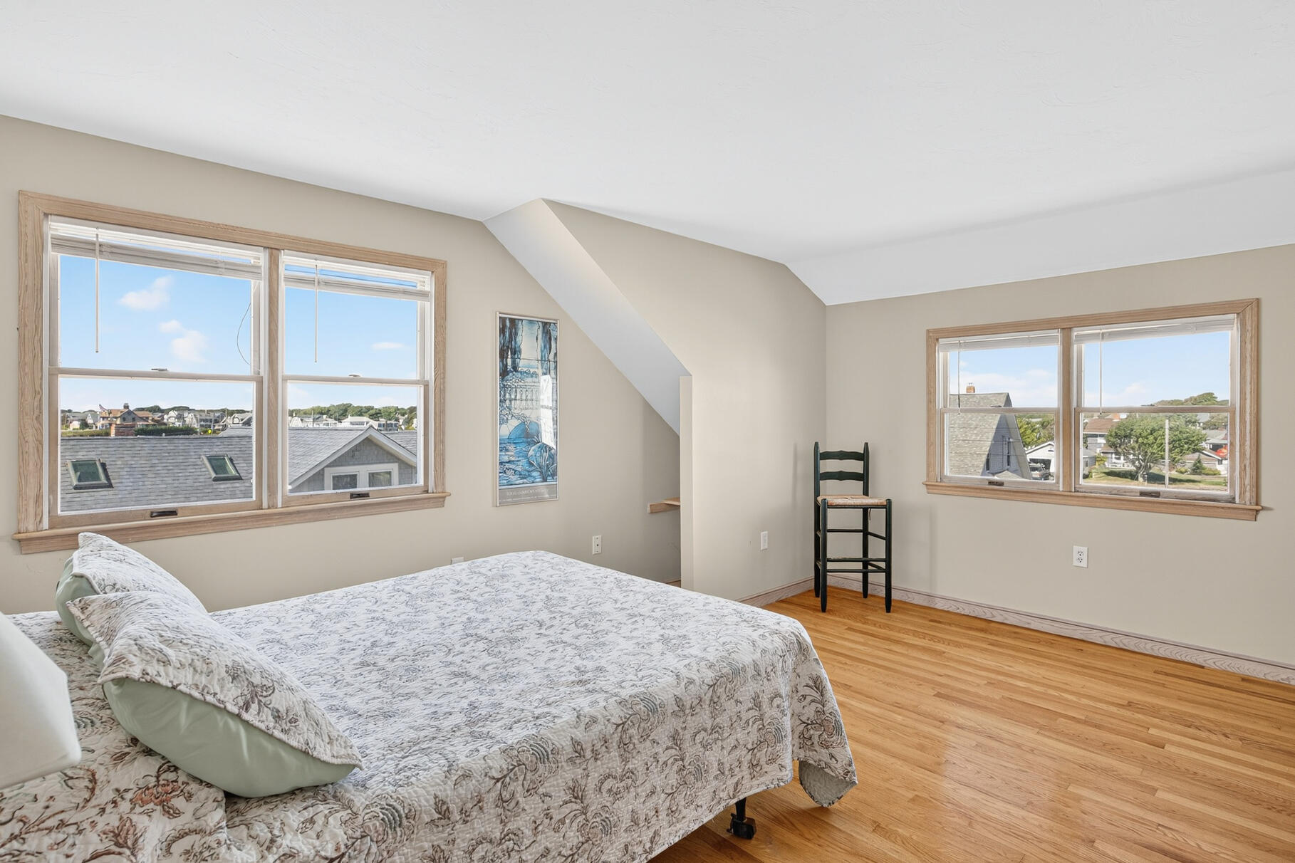 61 Menauhant Road East Falmouth, MA 02536 - Photo 31 of 65 a bedroom with a large bed and a large window