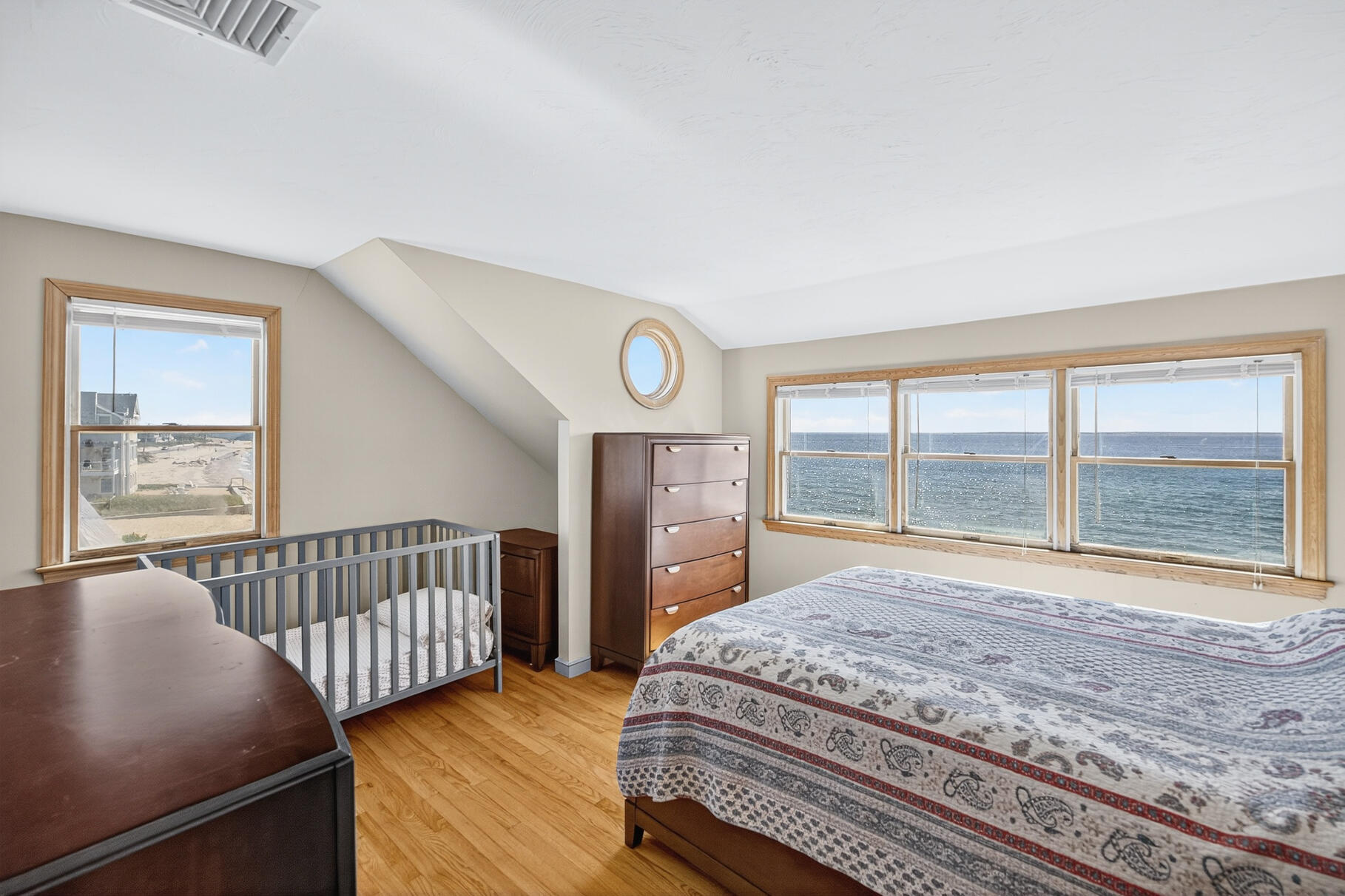 61 Menauhant Road East Falmouth, MA 02536 - Photo 33 of 65 a bedroom with a bed and a window