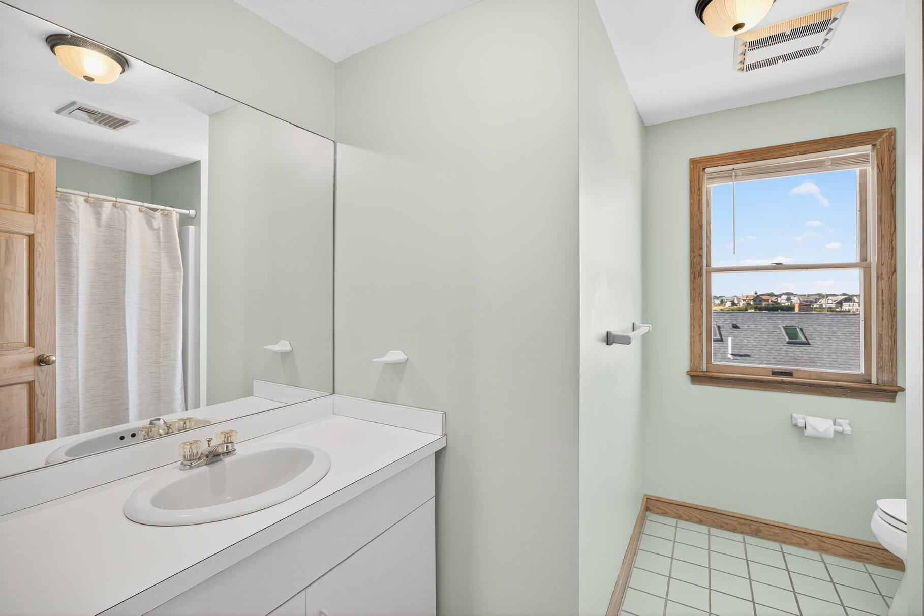 61 Menauhant Road East Falmouth, MA 02536 - Photo 35 of 65 a bathroom with a sink and a mirror