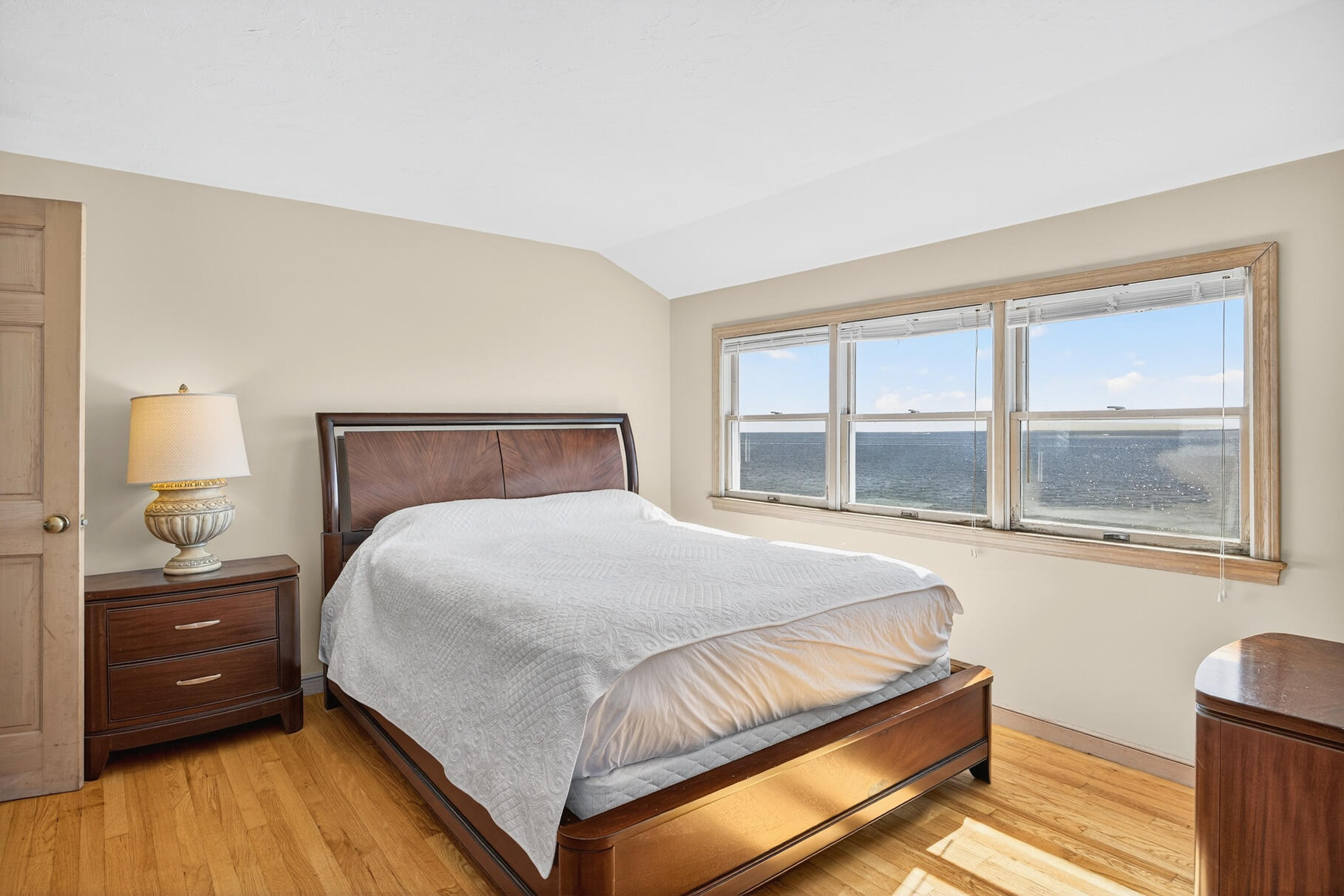 61 Menauhant Road East Falmouth, MA 02536 - Photo 36 of 65 a bedroom with a bed and a window