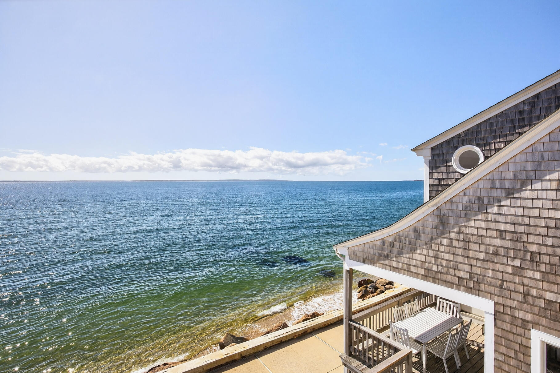 61 Menauhant Road East Falmouth, MA 02536 - Photo 42 of 65 a view of an ocean from a balcony