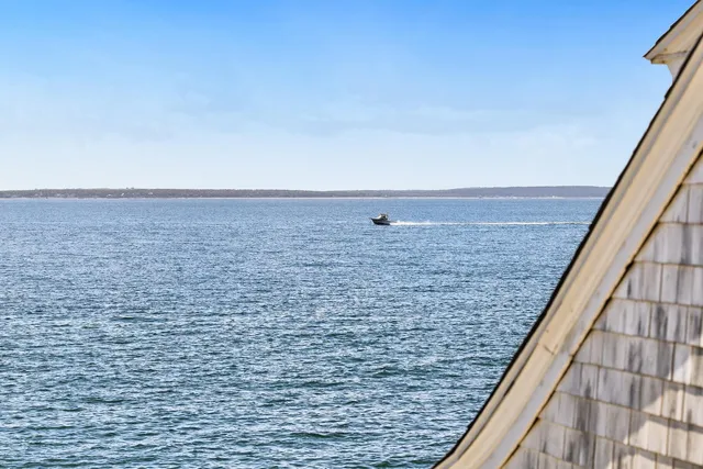 a view of a balcony with wooden floor