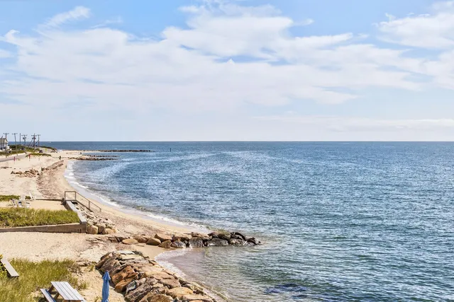 a view of a swimming pool with an outdoor seating