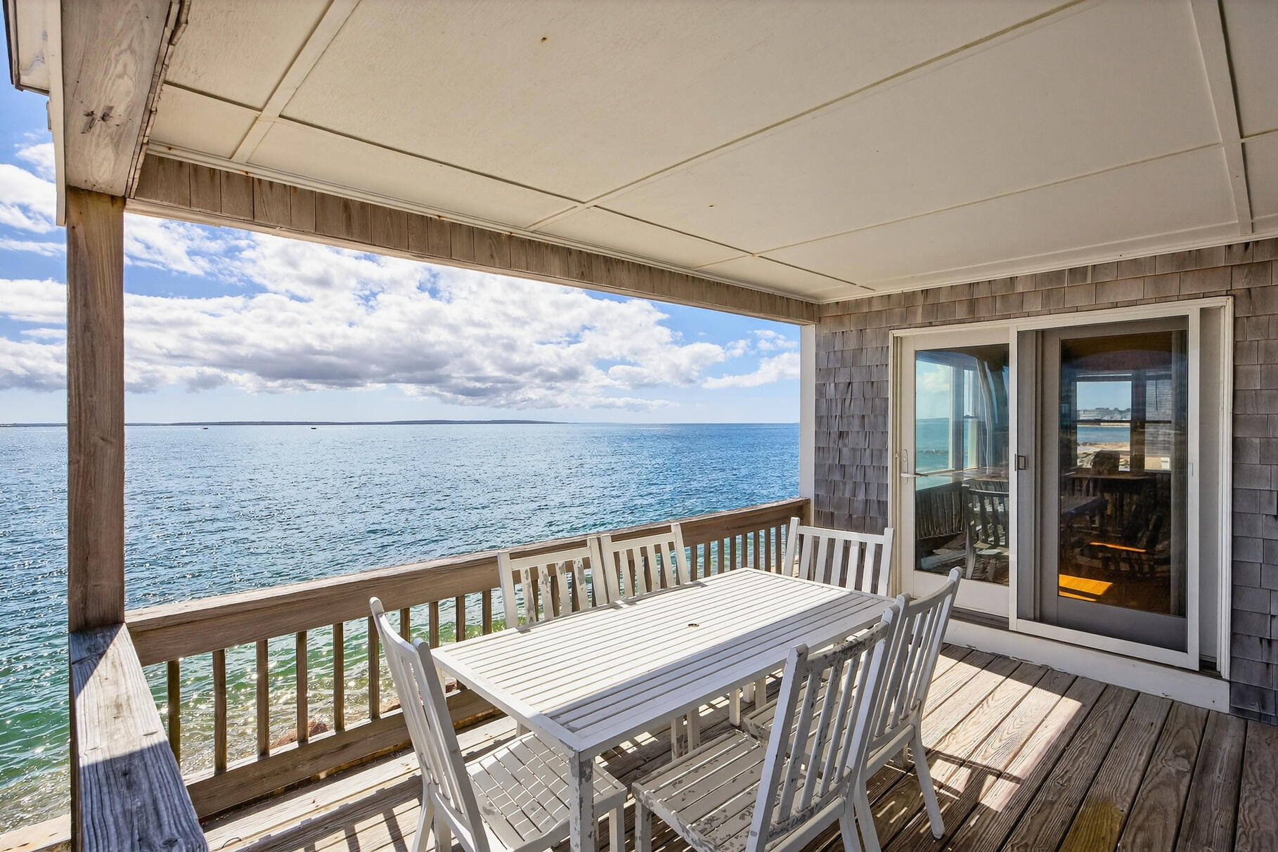 61 Menauhant Road East Falmouth, MA 02536 - Photo 48 of 65 a view of a two chair in the balcony