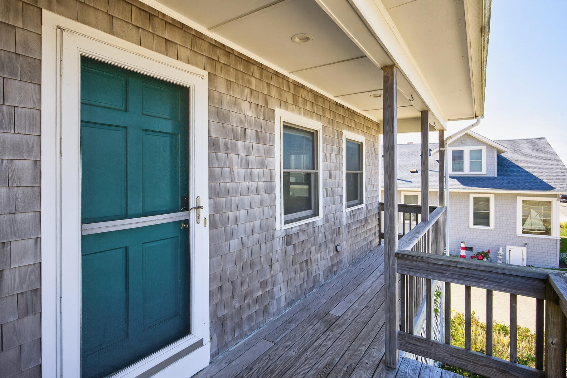 61 Menauhant Road East Falmouth, MA 02536 - Photo 51 of 65 a view of a house with a porch