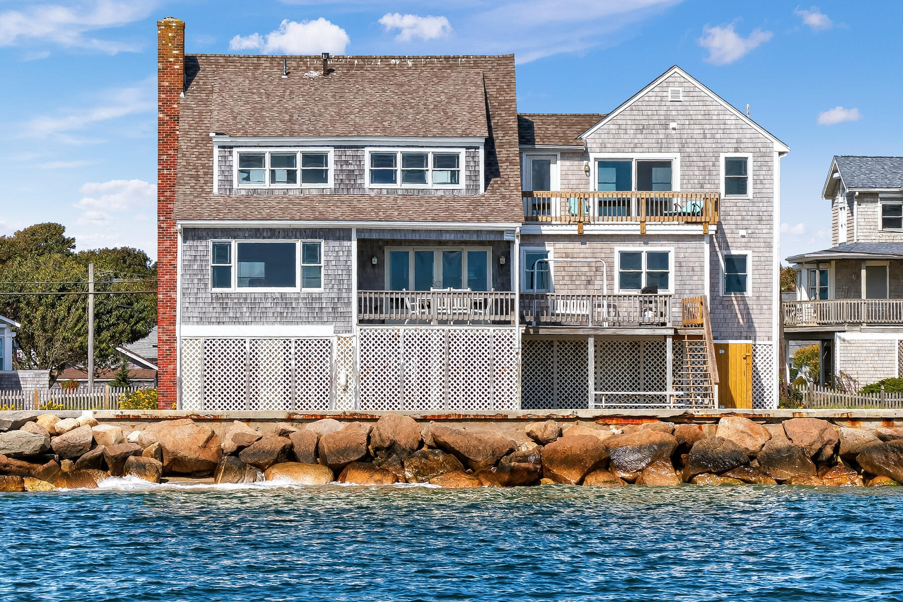 61 Menauhant Road East Falmouth, MA 02536 - Photo 8 of 65 a front view of a house with a yard