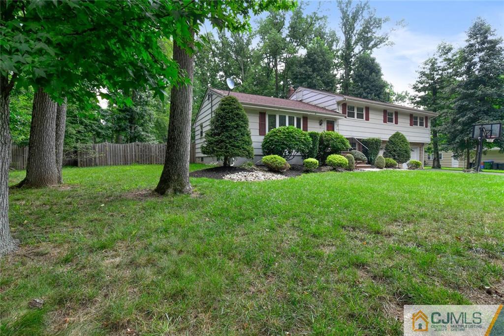 18 Tamarack Road Edison, NJ 08820 - Photo 2 of 25 a view of a house with a yard and deck