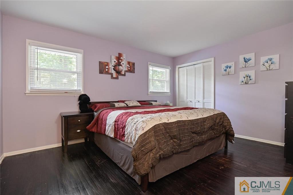 18 Tamarack Road Edison, NJ 08820 - Photo 11 of 25 a bed sitting in a bedroom next to a window