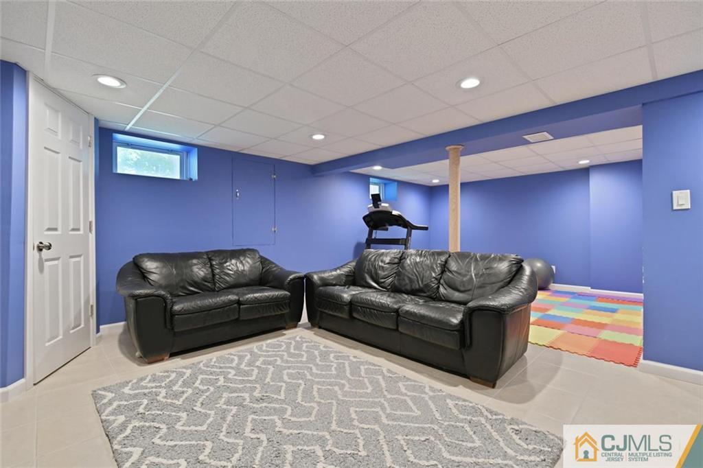 18 Tamarack Road Edison, NJ 08820 - Photo 18 of 25 a living room with furniture and a couch