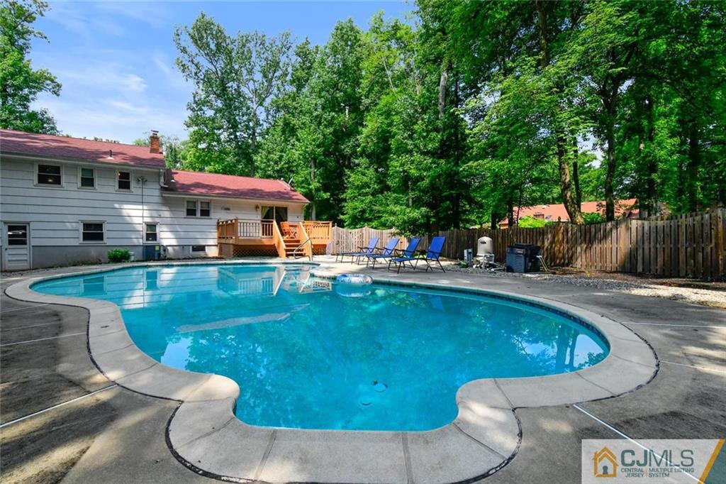 18 Tamarack Road Edison, NJ 08820 - Photo 20 of 25 a view of a swimming pool with a patio
