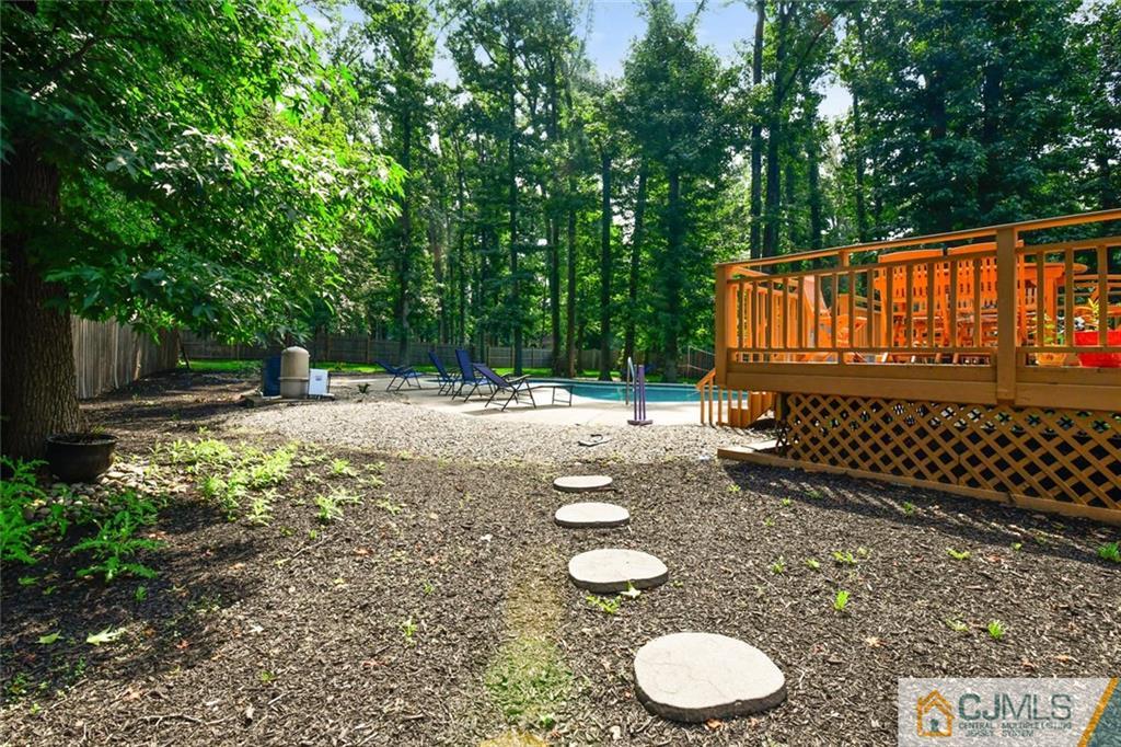 18 Tamarack Road Edison, NJ 08820 - Photo 25 of 25 a backyard of a house with table and chairs