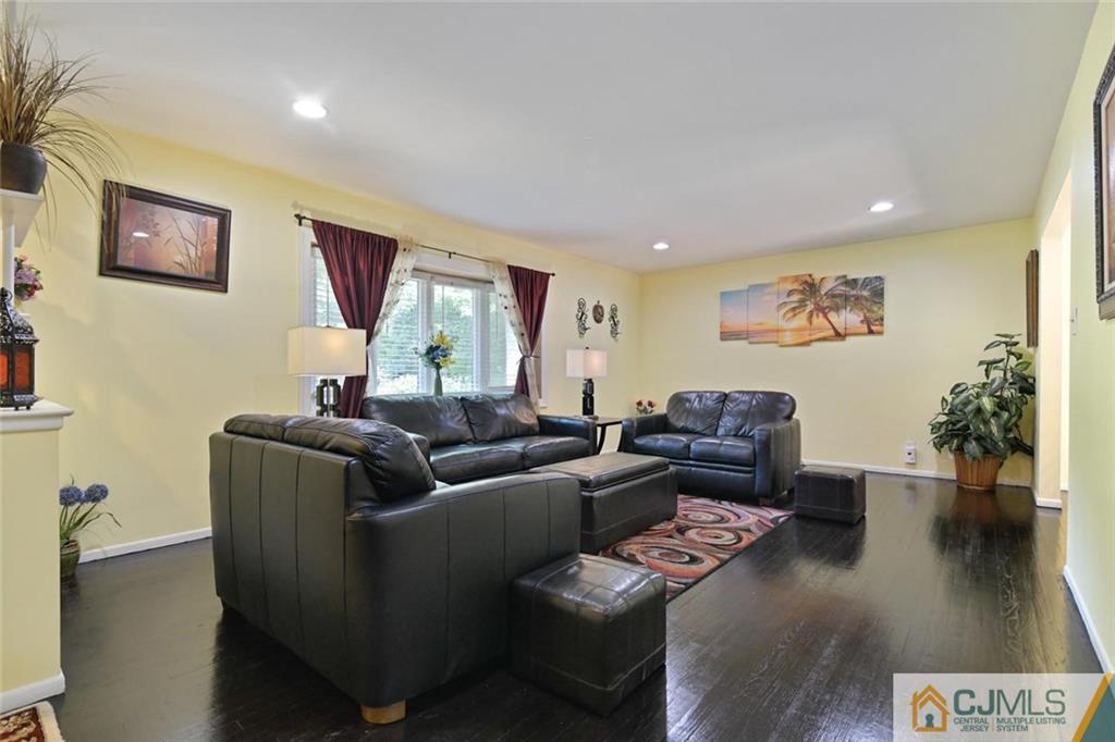 18 Tamarack Road Edison, NJ 08820 - Photo 4 of 25 a living room with furniture and a wooden floor