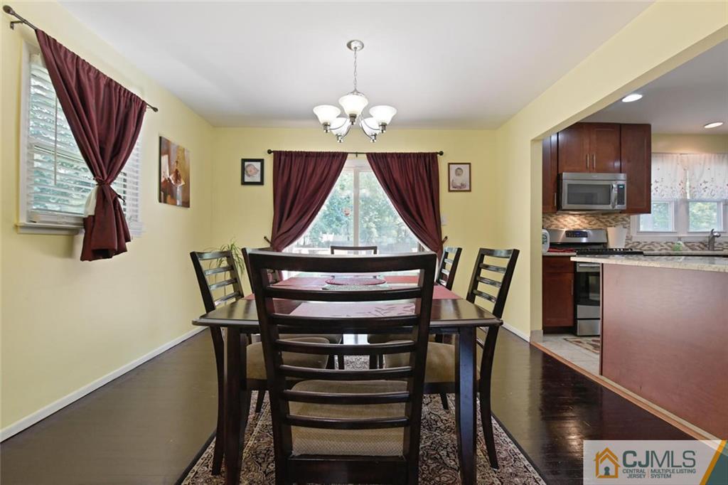 18 Tamarack Road Edison, NJ 08820 - Photo 6 of 25 a view of a dining room with furniture and a chandelier