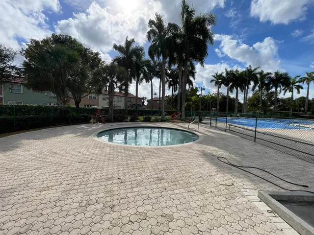 a view of swimming pool with trees